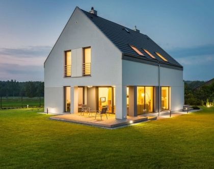 House in the country - an original shape and consistent colours of barn house. 